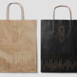 Two bakery bags displayed side by side, one in brown kraft paper and the other in black paper, both featuring the "No 10 Bakery" logo and geometric wheat pattern in gold.